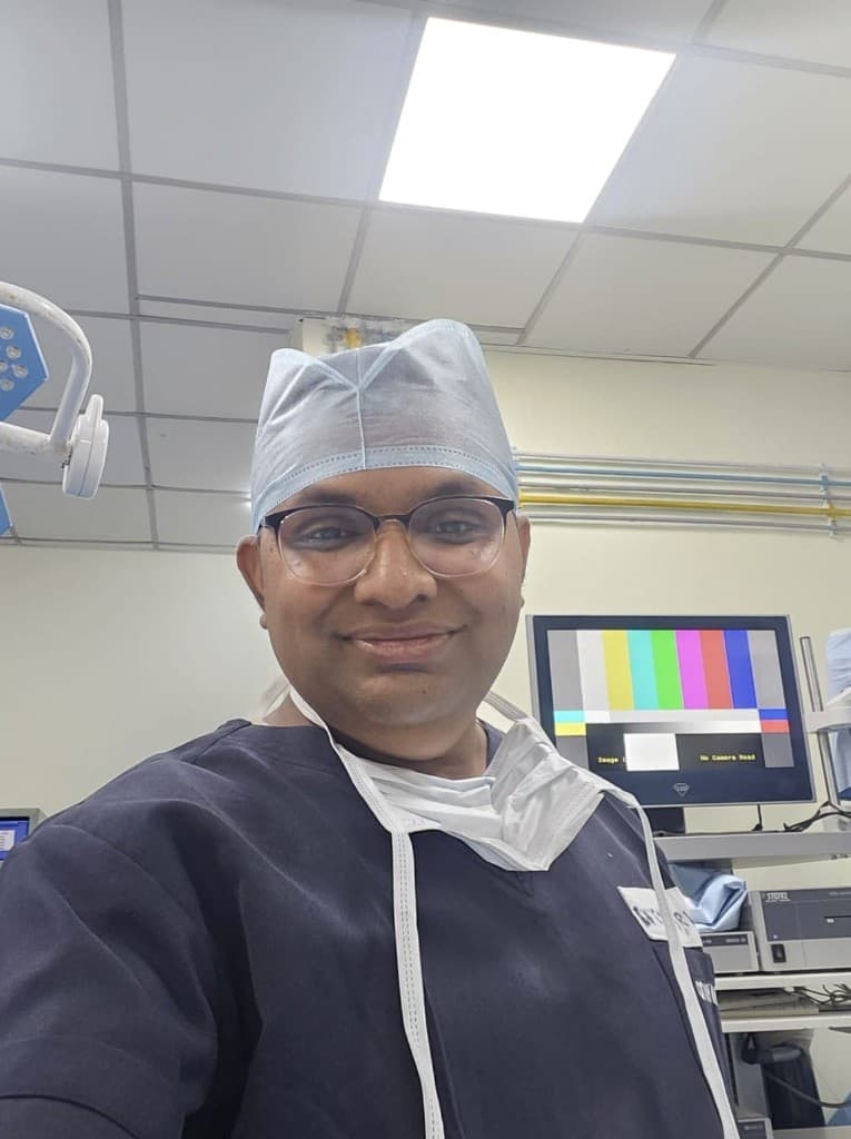 Lt Col (Dr) Parvez Mullani (Retd) in clinical attire
